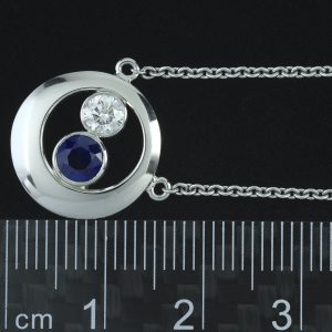Platinum 0.25ct Diamond 0.55ct Sapphire Elliptical Necklace