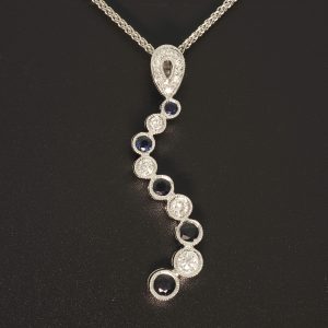 18ct White Gold Diamond & Sapphire Wave Pendant & 18ct Chain