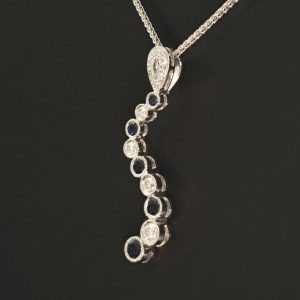 18ct White Gold Diamond & Sapphire Wave Pendant & 18ct Chain